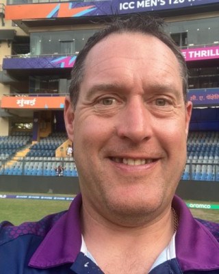 Gary Metcalfe at a cricket stadium